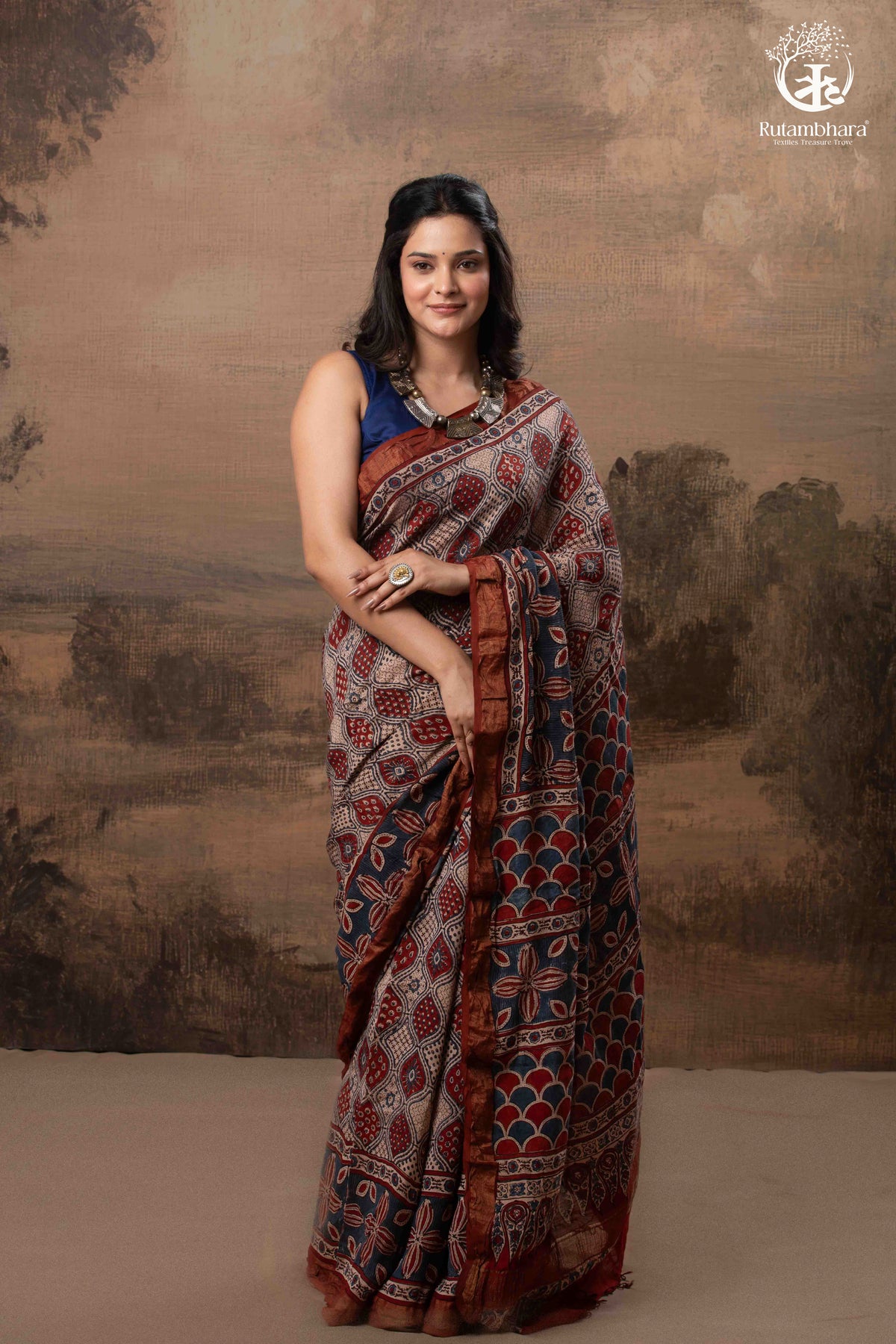 Ushraa - Rust Red & Indigo Ajrakh Silk Cotton Saree With Delicate Gold Zari Border