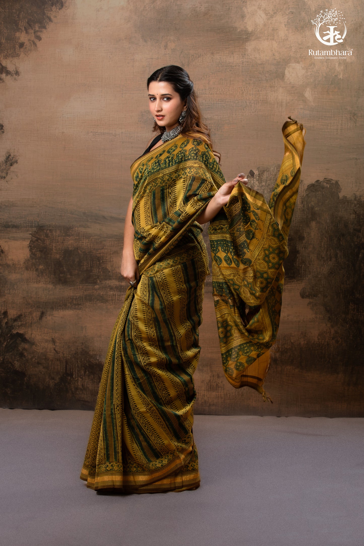 Ushraa - Mustard And Forest Green Ajrakh Hand Block Printed Cotton Silk Saree with Gold Zari Border