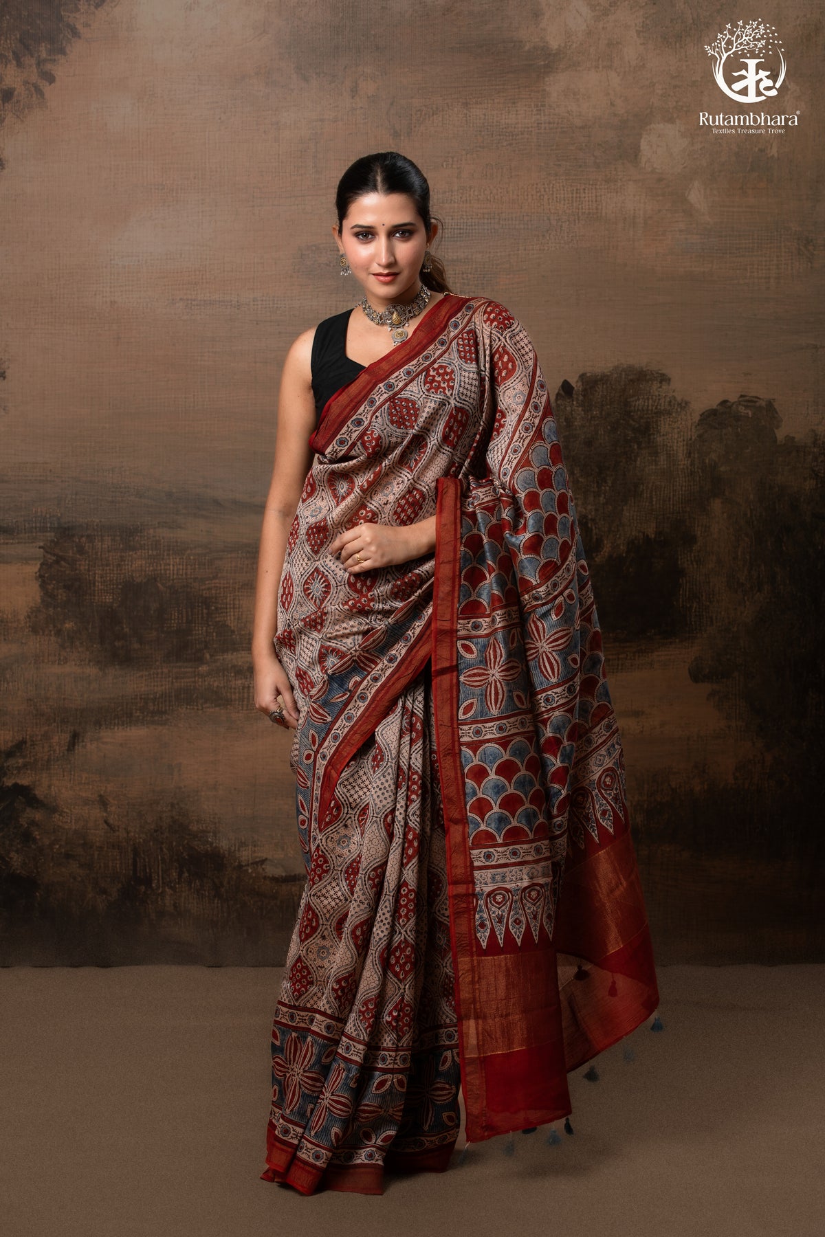 Ushraa - Rust Red and Indigo Ajrakh Silk Cotton Saree with Delicate Gold Zari Border