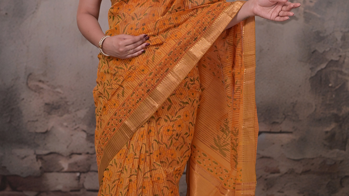 Mustard orange handwoven cotton saree with hand block print and gold zari border