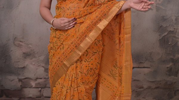 Mustard orange handwoven cotton saree with hand block print and gold zari border