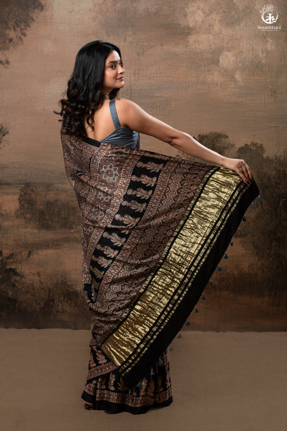 Ushraa - Ajrakh Hand Block Printed Black Modal Silk Saree With Gold Zari Border-RUTAMBHARA-RUTAMBHARA