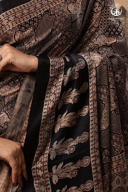 Ushraa - Ajrakh Hand Block Printed Black Modal Silk Saree With Gold Zari Border-RUTAMBHARA-RUTAMBHARA