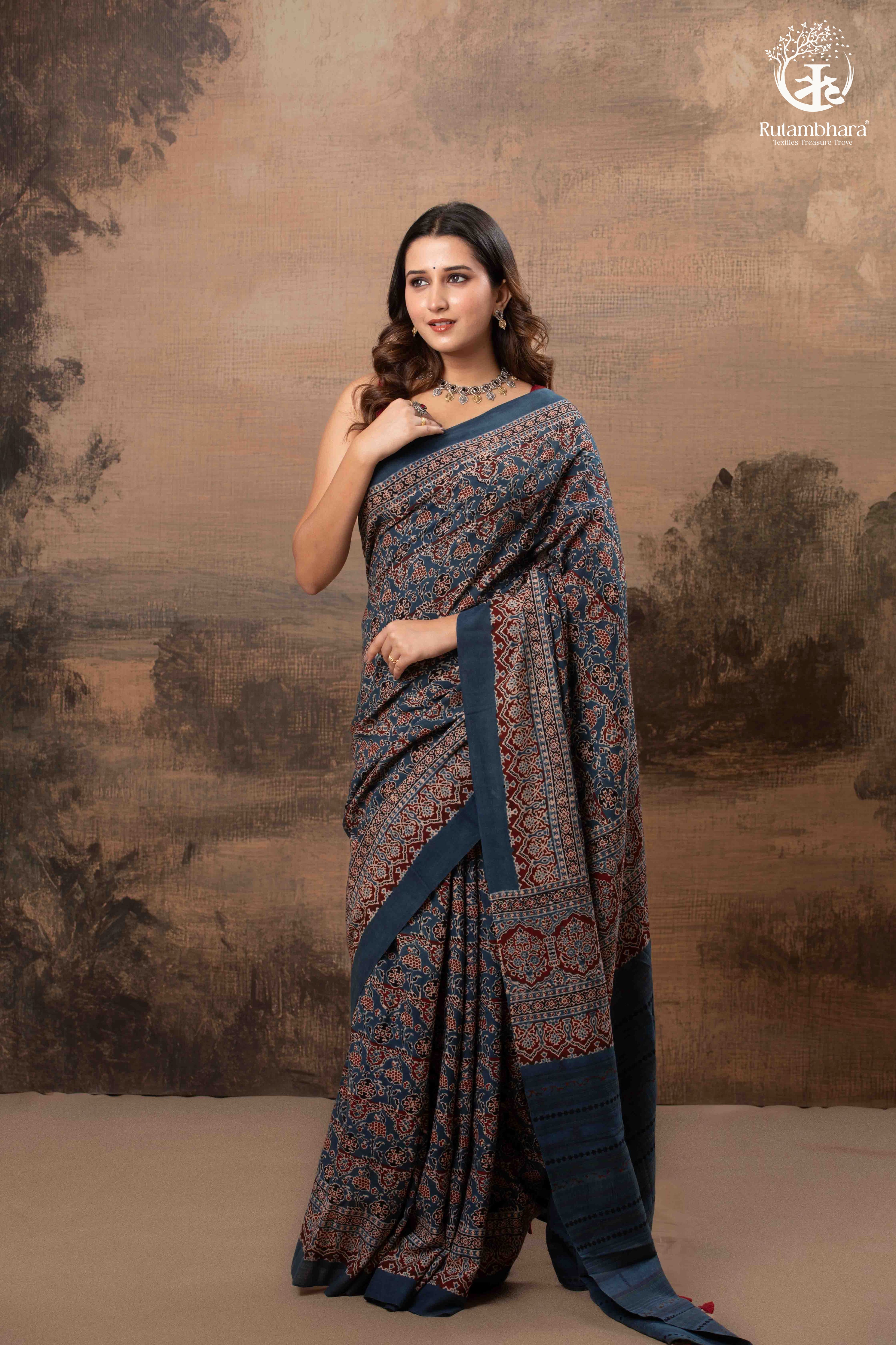 Ushraa - Ajrakh in Indigo Hues on a handwoven Kutchhi weave Kala Cotton Saree