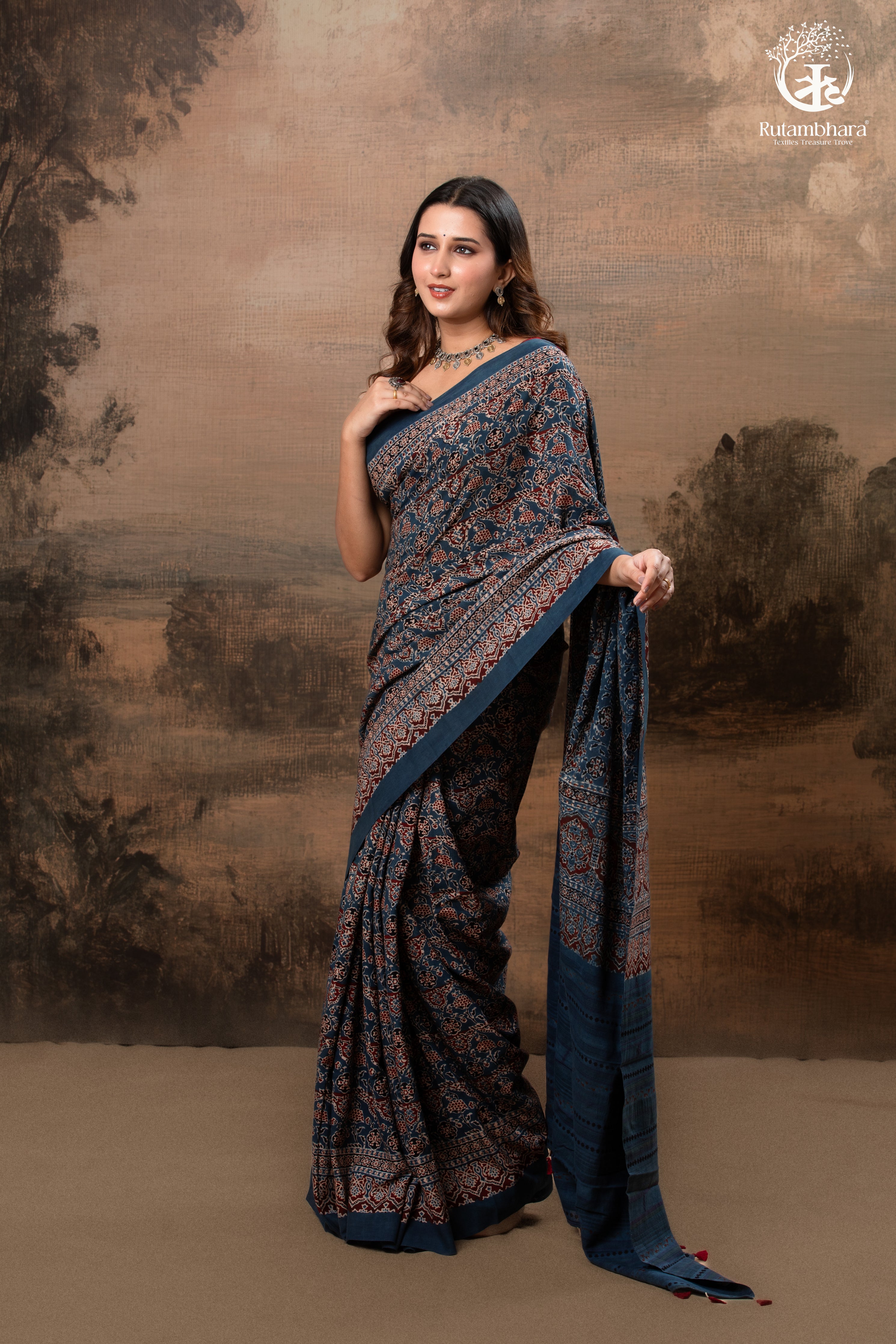 Ushraa - Ajrakh in Indigo Hues on a handwoven Kutchhi weave Kala Cotton Saree