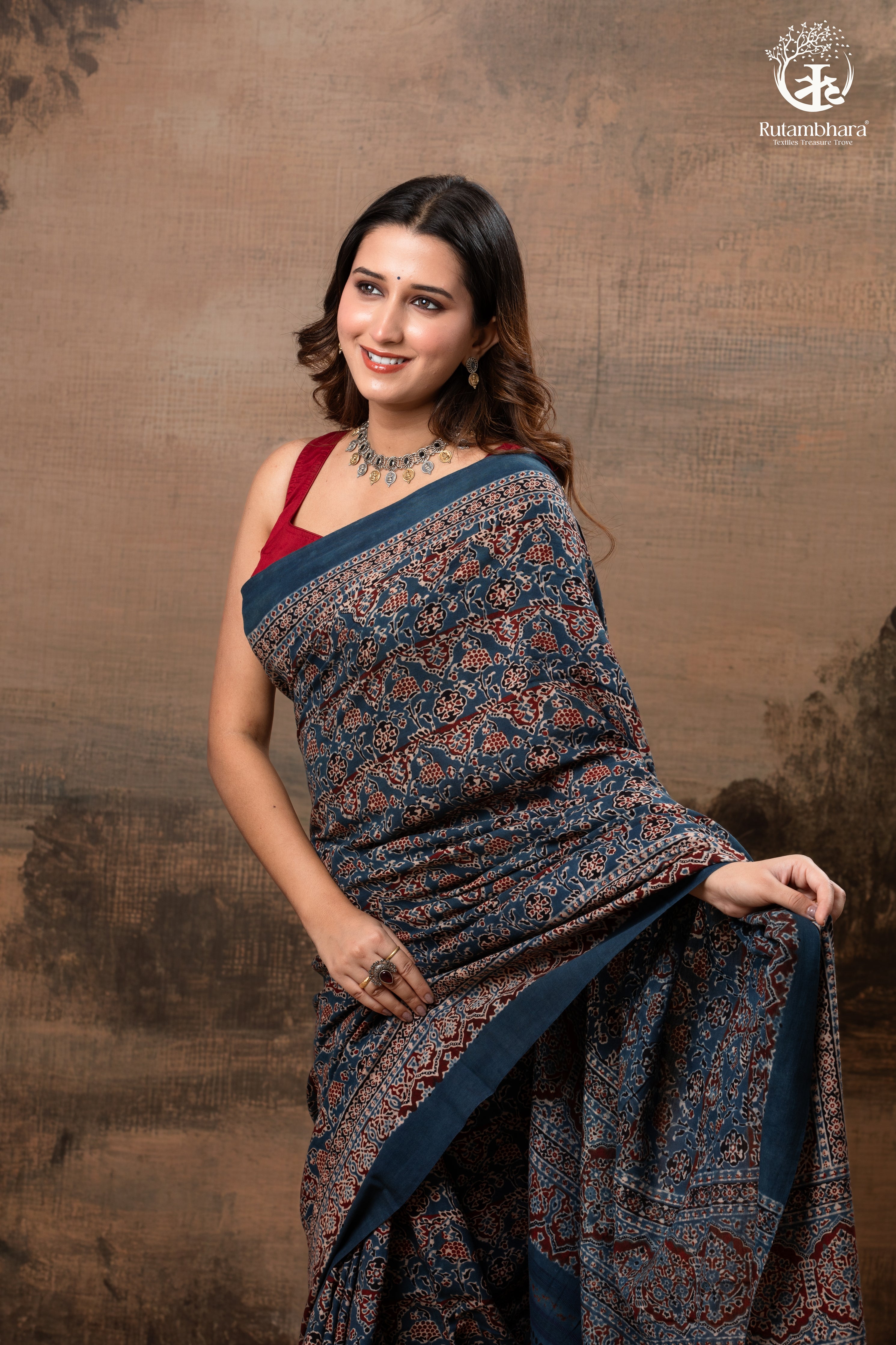 Ushraa - Ajrakh in Indigo Hues on a handwoven Kutchhi weave Kala Cotton Saree