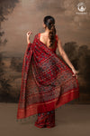 Ushraa - Vermilion Red Ajrakh Silk Cotton Saree with Delicate Gold Zari Border