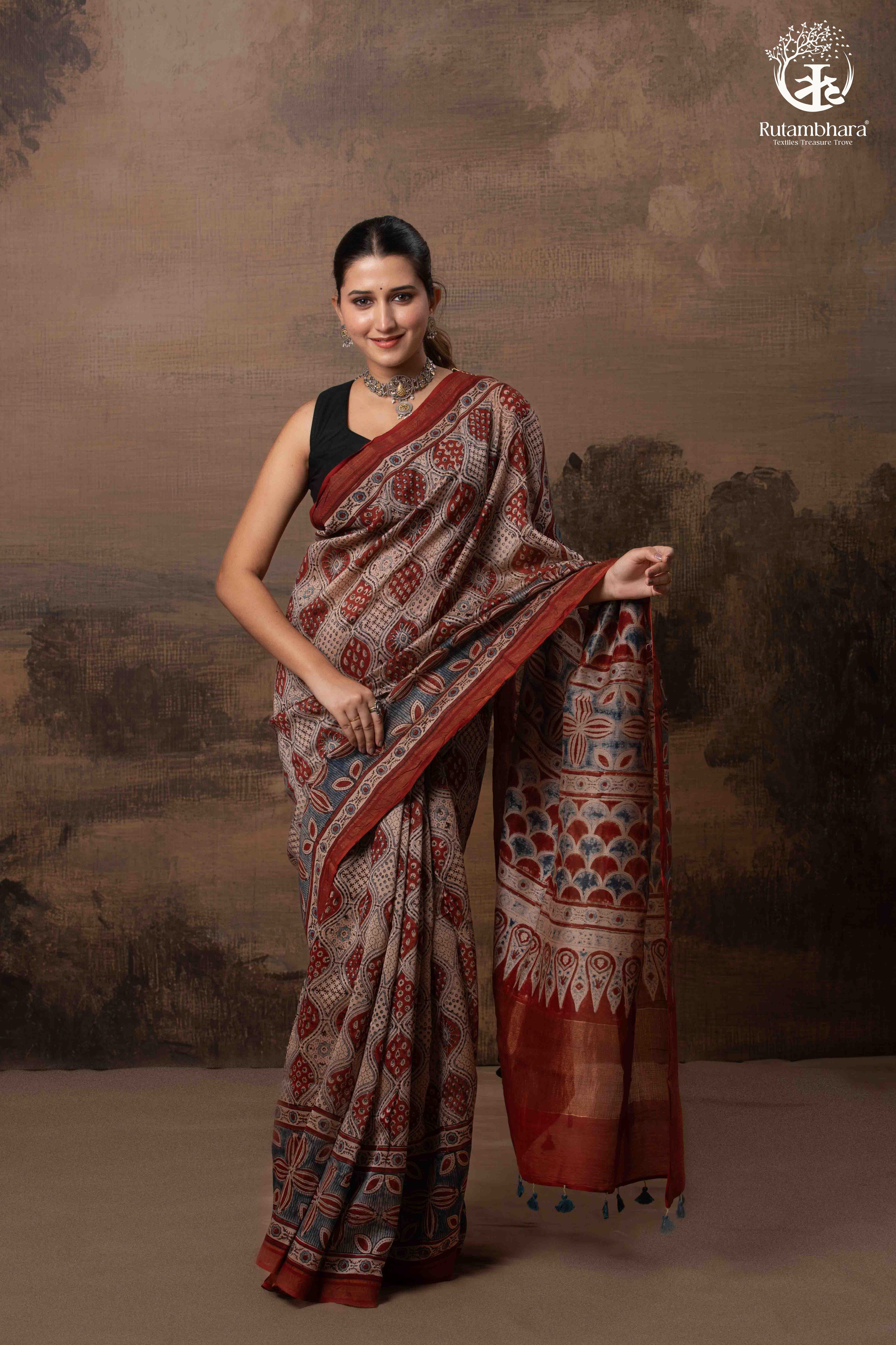 Ushraa - Rust Red and Indigo Ajrakh Silk Cotton Saree with Delicate Gold Zari Border