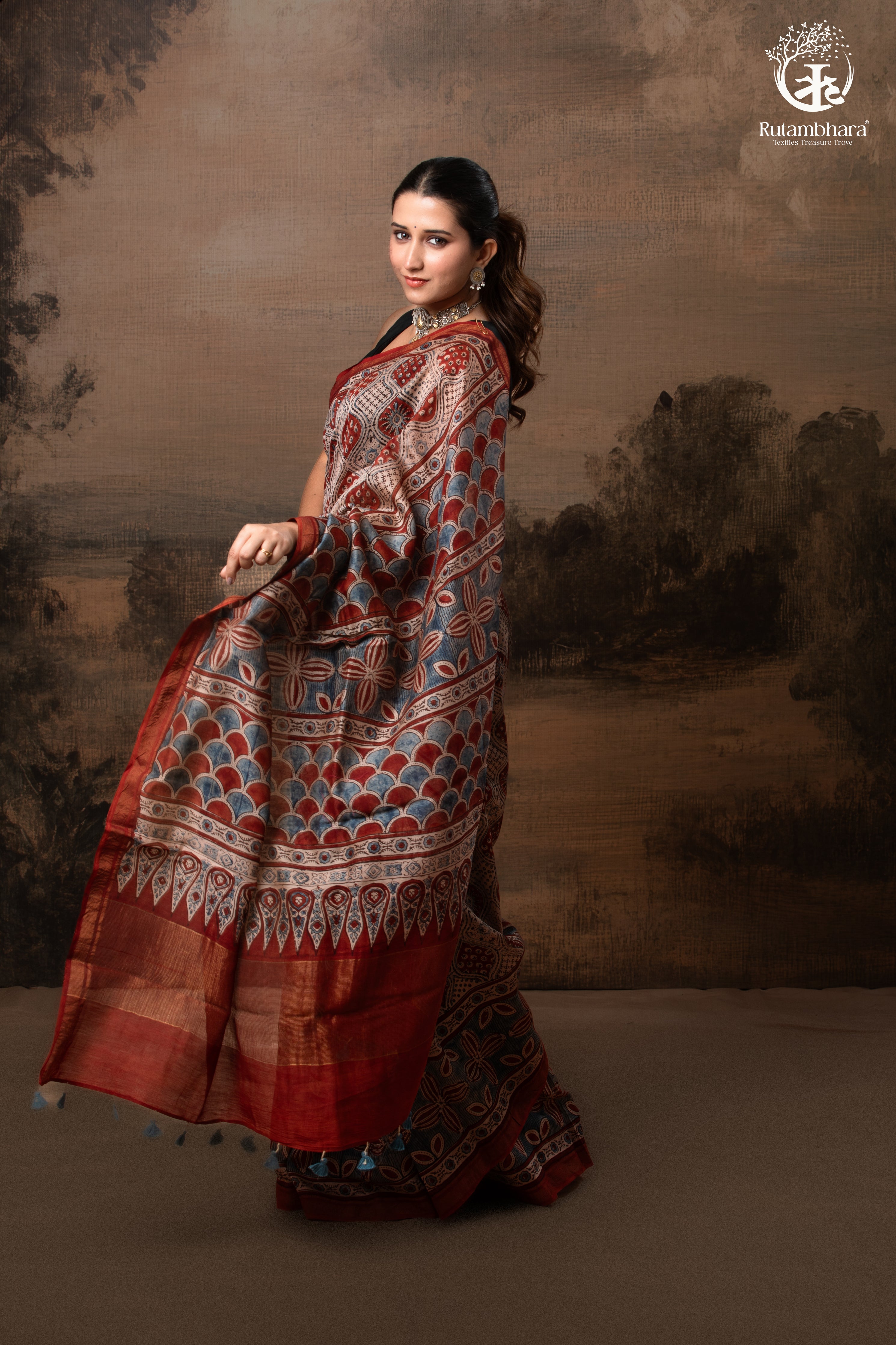 Ushraa - Rust Red and Indigo Ajrakh Silk Cotton Saree with Delicate Gold Zari Border