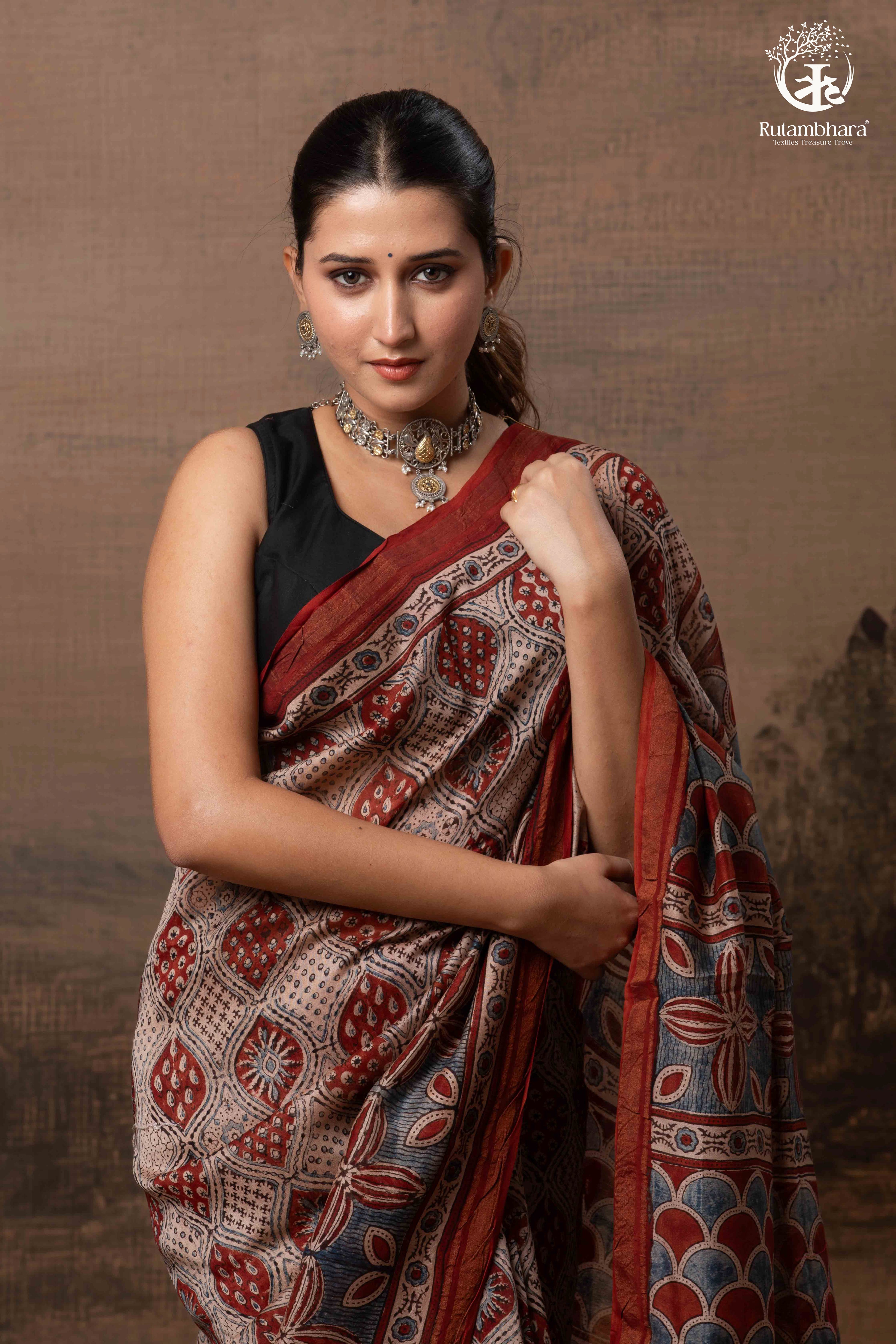 Ushraa - Rust Red and Indigo Ajrakh Silk Cotton Saree with Delicate Gold Zari Border