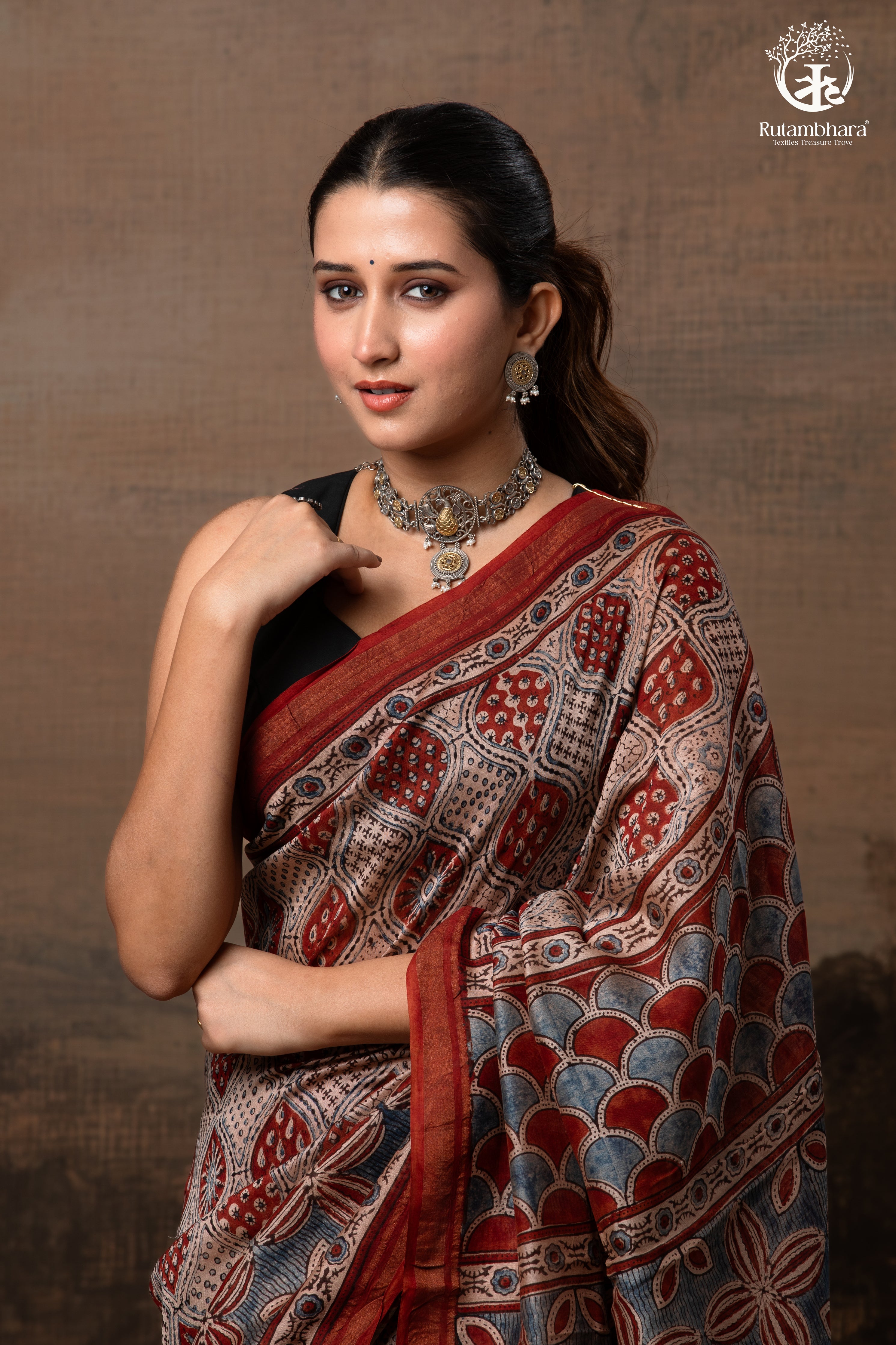 Ushraa - Rust Red and Indigo Ajrakh Silk Cotton Saree with Delicate Gold Zari Border