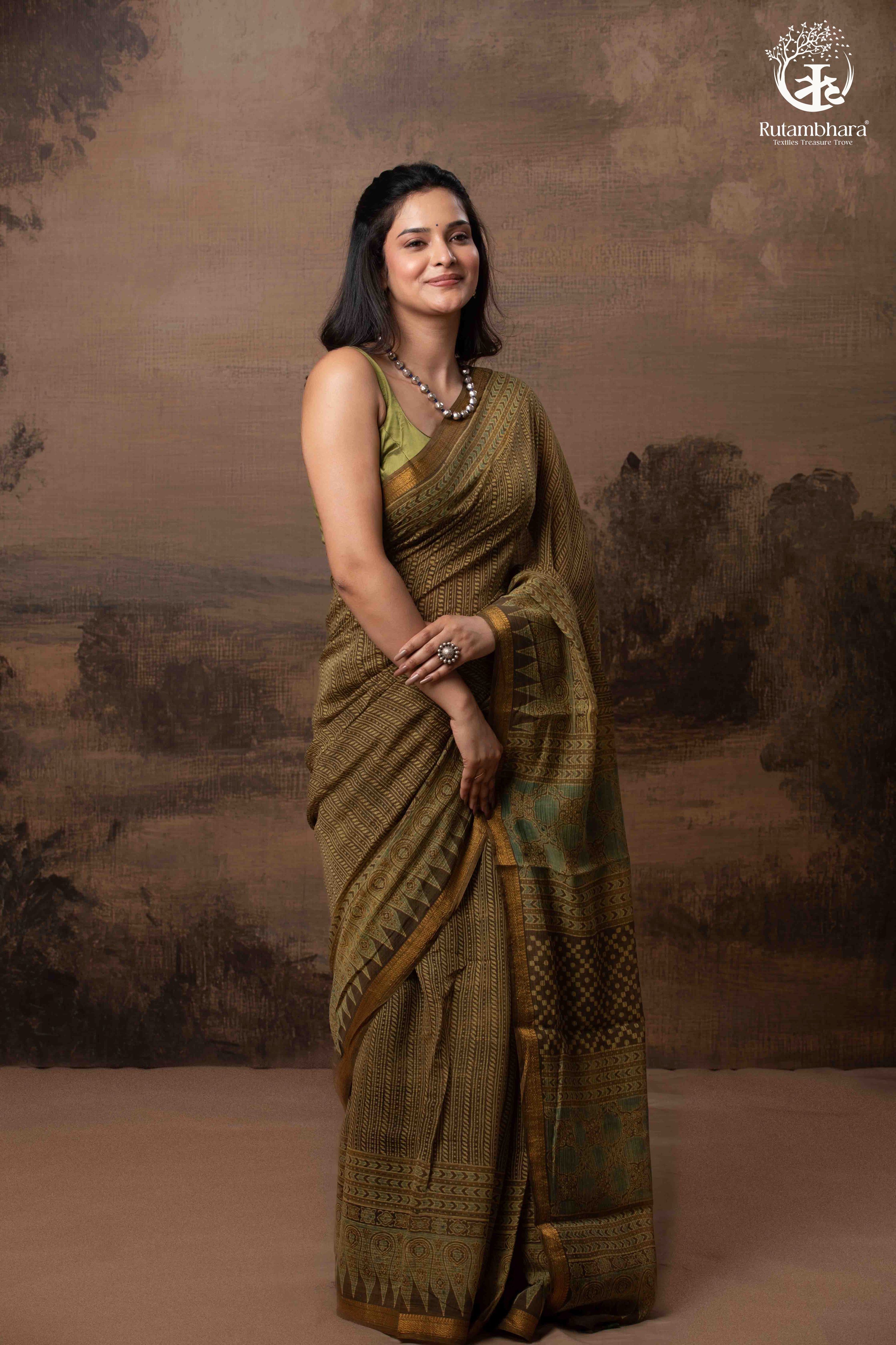 Ushraa -  Earthy Olive Ajrakh Kota Silk Cotton Saree with Delicate Gold Zari Border