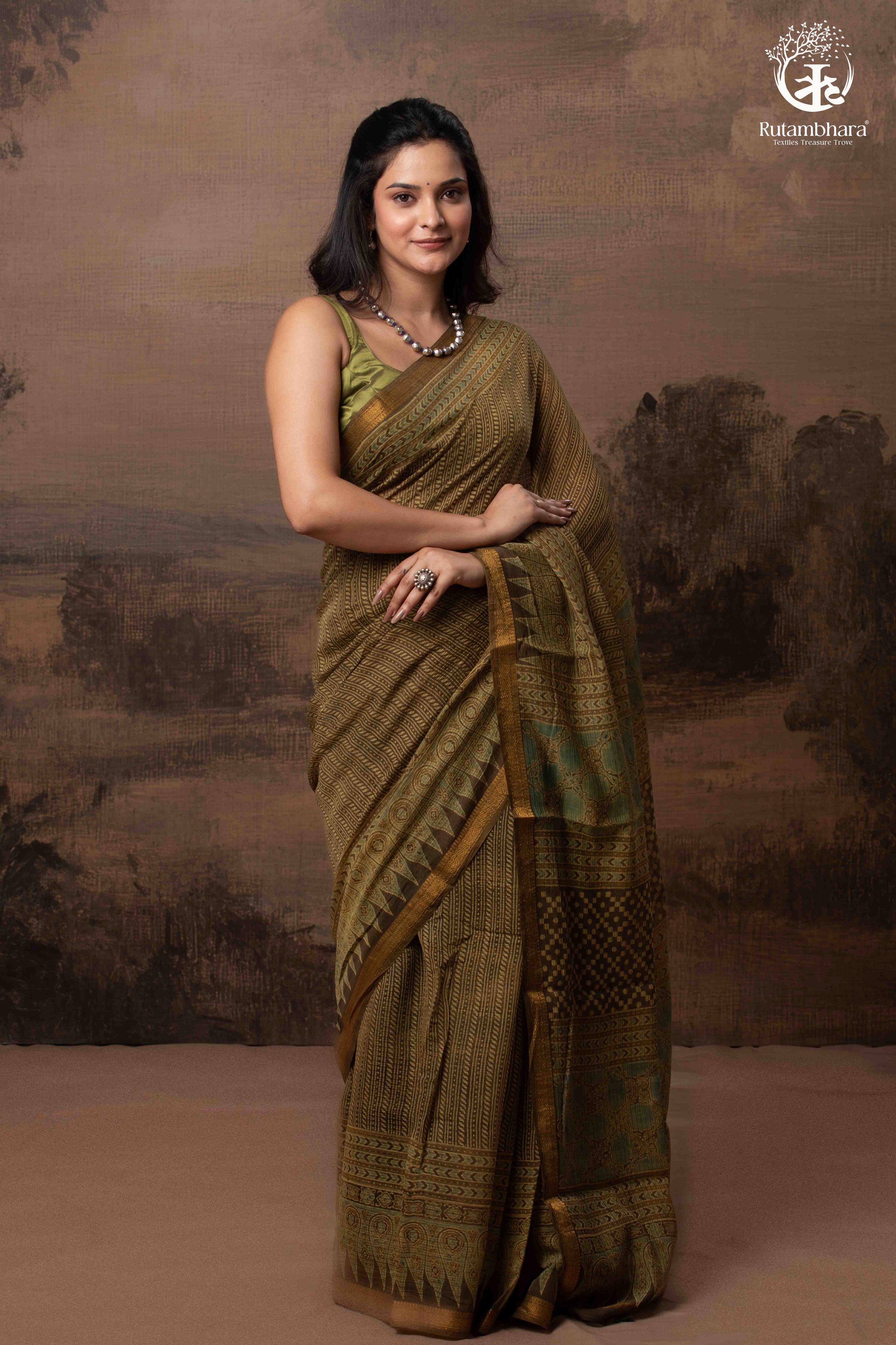 Ushraa -  Earthy Olive Ajrakh Kota Silk Cotton Saree with Delicate Gold Zari Border