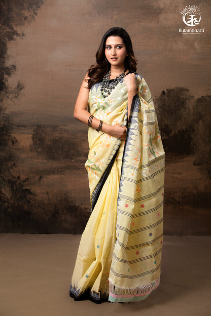 Woman wearing a yellow saree with a scenic background