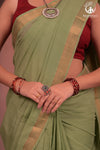 BHADRA - Elegant Pastel green Pure Cotton Saree with Gold Border and Kalamkari Blouse