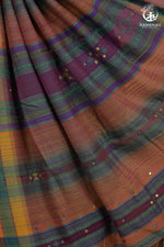Colorful woven pallu with mirror work embroidery, featuring the brand 'Rutambhara'.