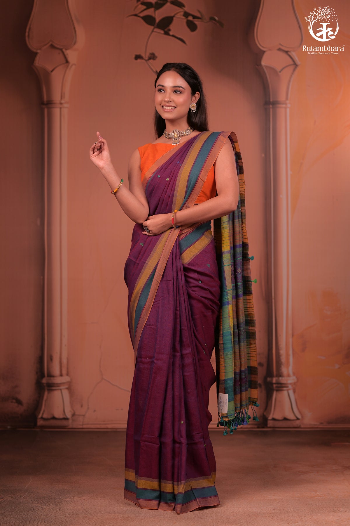JESAAL - Elegant Handloom Cotton Saree In Plumb With Vibrant Kutchhi Pallu.