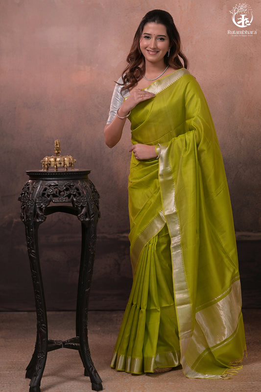 Bhadra - Lemon Green  Plain Handwoven Silk Saree With Silver Zari Border