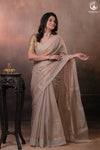Swarvi - Pastel Beige Two Taar Chanderi Tissue Saree with Powder Blue Selvedge