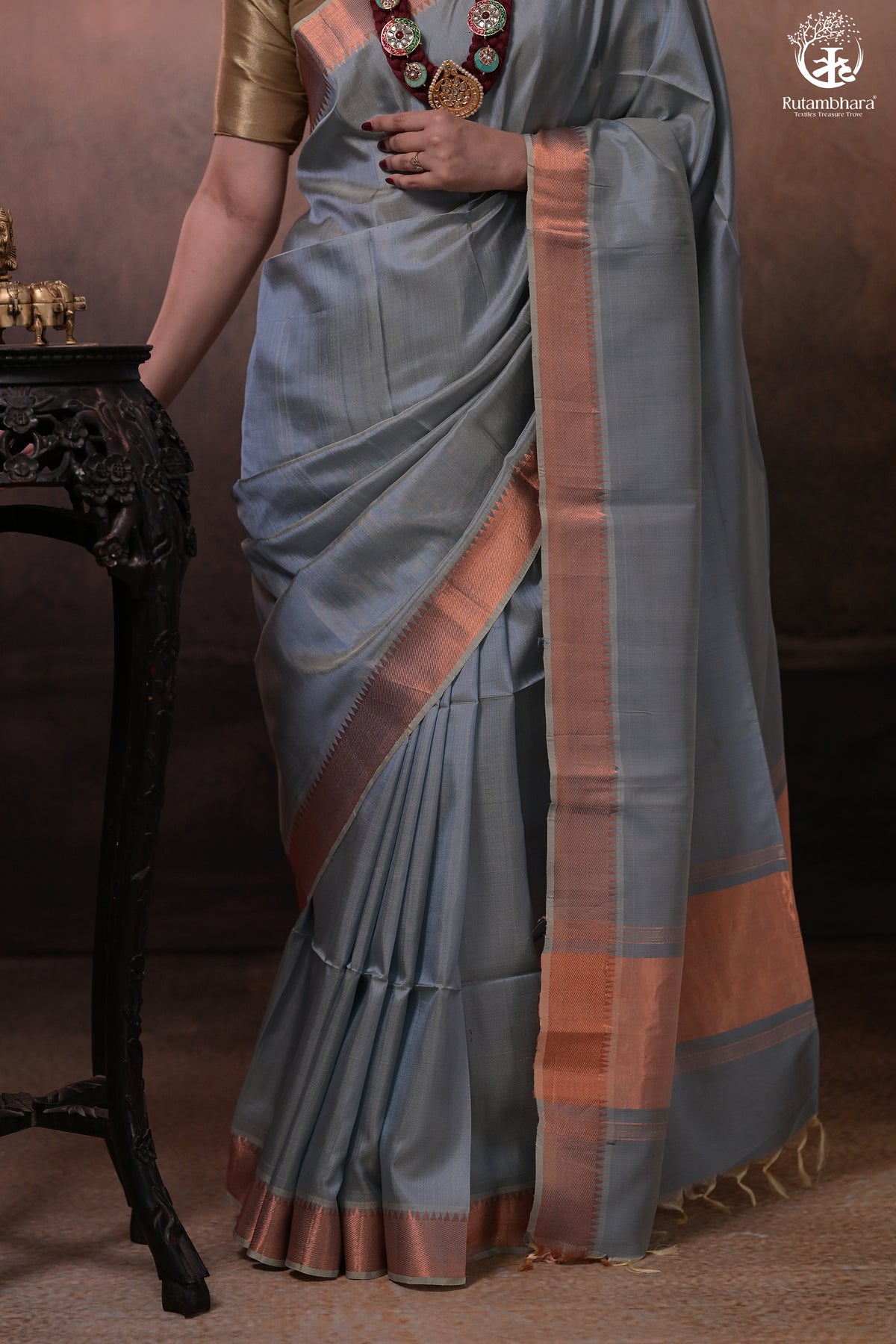 Bhadra - Powder Blue Plain Handwoven Silk Saree With Copper Zari Border