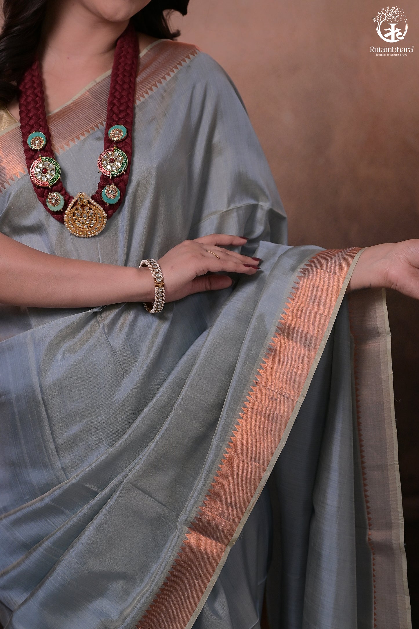 Bhadra - Powder Blue Plain Handwoven Silk Saree With Copper Zari Border