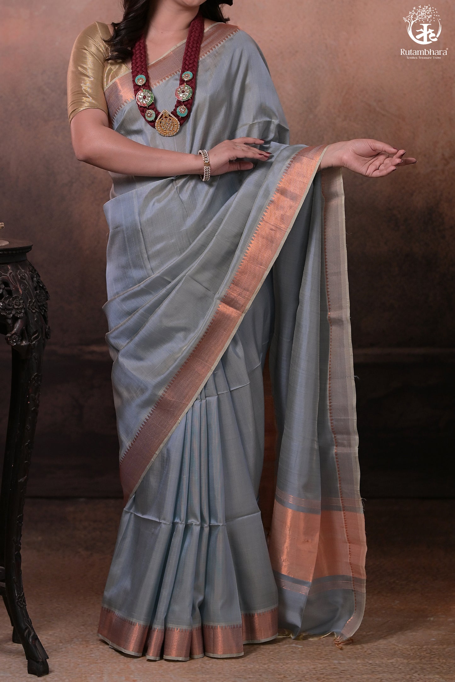 Bhadra - Powder Blue Plain Handwoven Silk Saree With Copper Zari Border