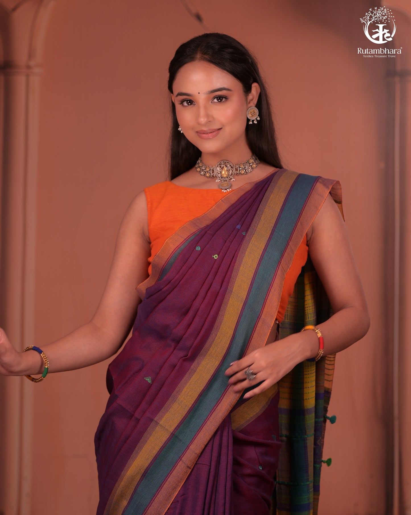 JESAAL - Elegant Handloom Cotton Saree In Plumb With Vibrant Kutchhi Pallu.