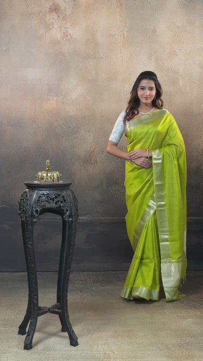 Bhadra - Lemon Green  Plain Handwoven Silk Saree With Silver Zari Border