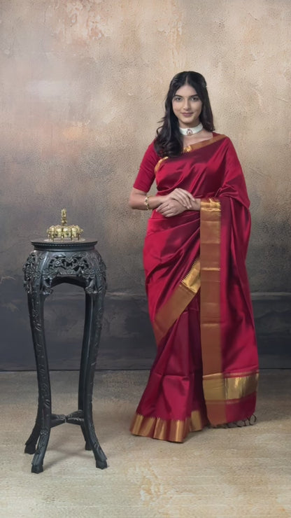 Bhadra - Reddish Maroon Plain Handwoven Silk Saree With Gold Zari Border