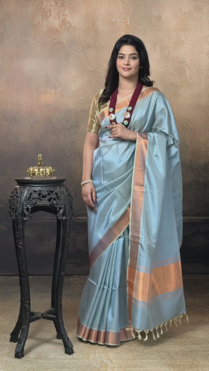 Bhadra - Powder Blue Plain Handwoven Silk Saree With Copper Zari Border