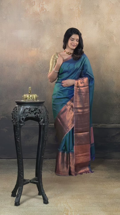 Bhadra - Teal Blue Plain Handwoven Silk Saree With Copper Zari Border