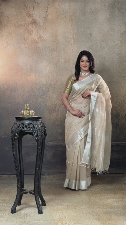 Swarvi - Pastel Beige Two Taar Chanderi Tissue Saree with Powder Blue Selvedge
